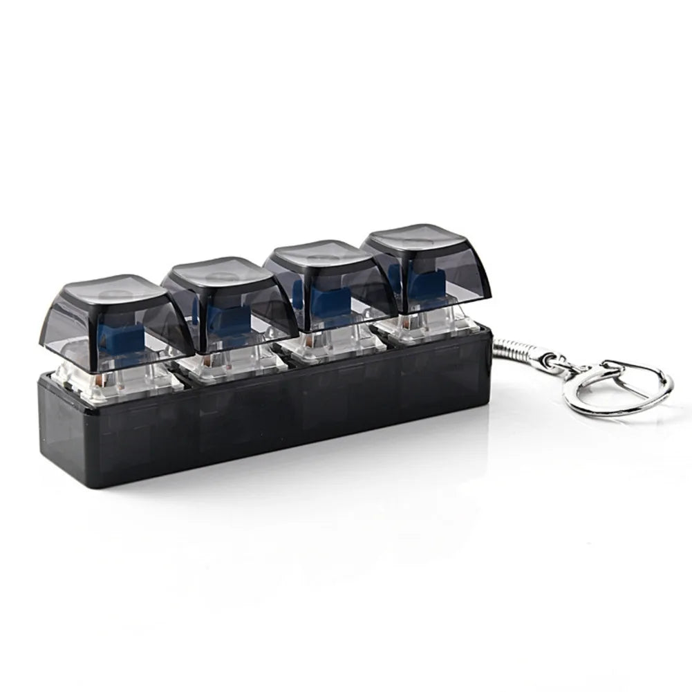 ClickVibe 4-Key Bar fidget keychain shown for size in a hand