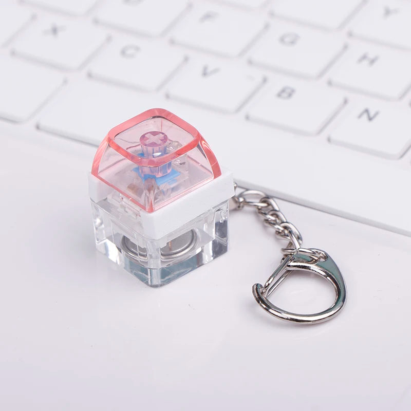 ClickVibe Single Key keychain showing the LED backlight