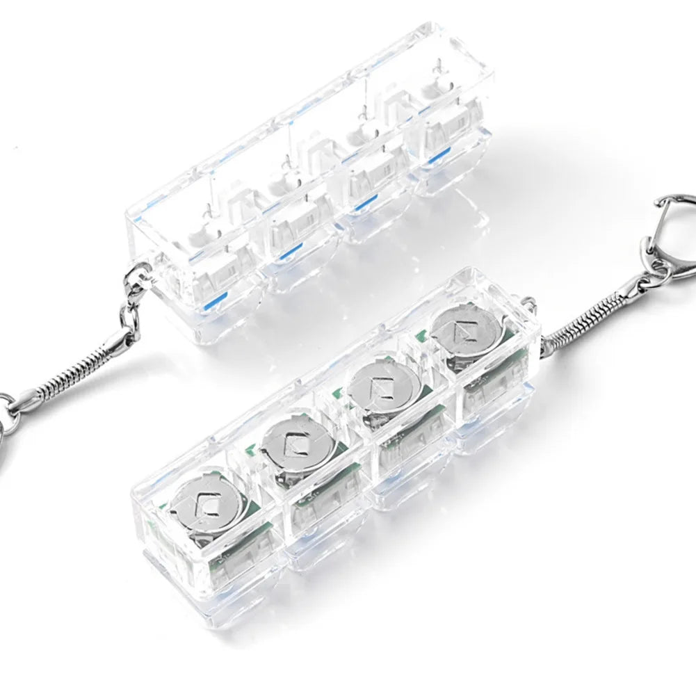 Mechanical fidget keychain with four clicky switches held in hand