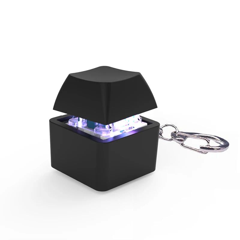 ClickVibe Single Key pocket fidget toy on a desk