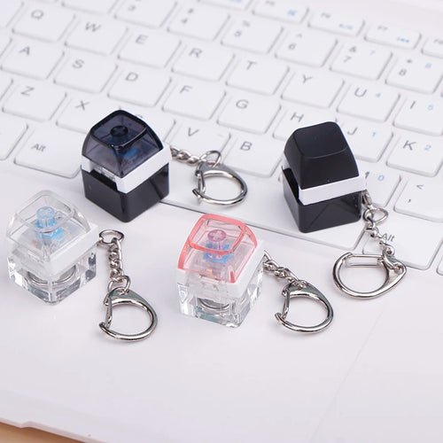Single mechanical keyboard switch keychain glowing with LED light